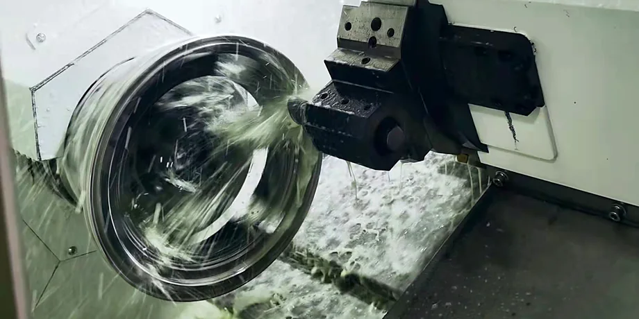 Stainless-steel vacuum component being machined on CNC equipment